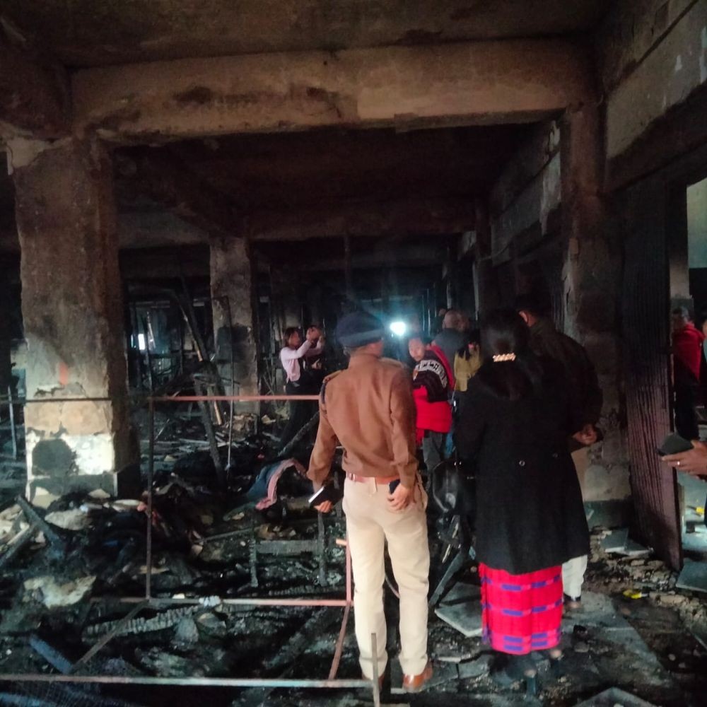 Officials at the site of the fire at the MMC Shopping complex on February 4. (Morung Photo)